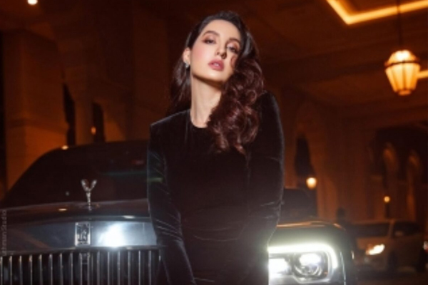 Nora posted a galamorous picture in a black dress