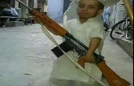 Azam Mansuri of two and a half feet seen with INSAS rifle, may be difficult