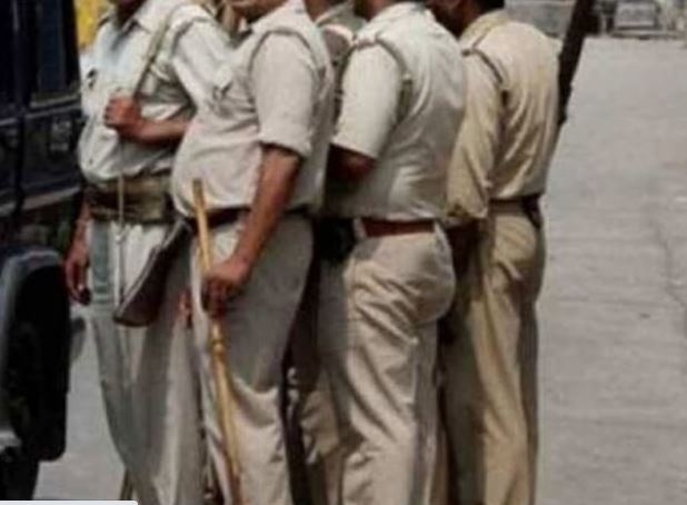 Five constables line up to take food from the hotel without paying